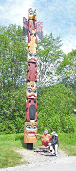 Walter Cooke with totem at Saxman Totem Park