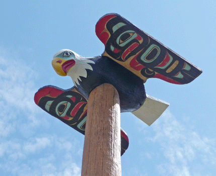 Figurehead on totem at Saxman Totem Park Ketchikan