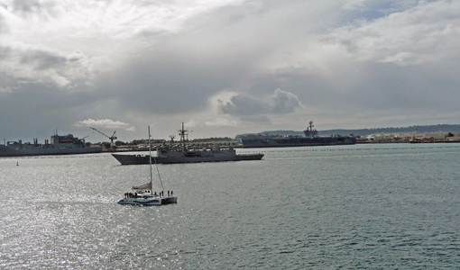 Catamaran, destroyer and battleship in San Diego harbor