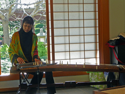 Woman playing Koto Japanese Garden San Diego