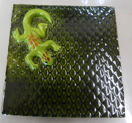 Gecko on green tile