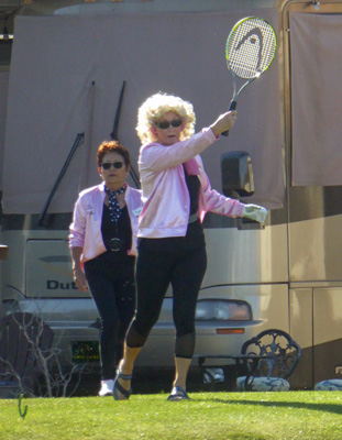 Playing golf with a tennis racket