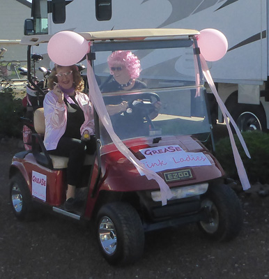 Decorated golf cart and golfers