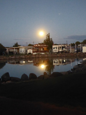 Full moon reflected in lake