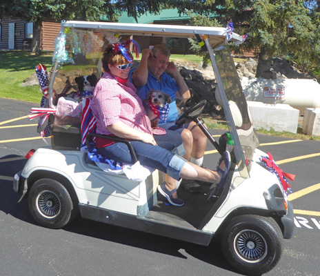 People and dog in 4th of July parade