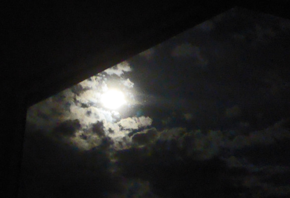 full moon through clouds
