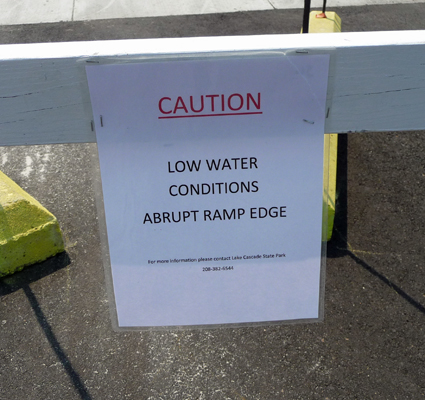 Boat ramp low water caution sign