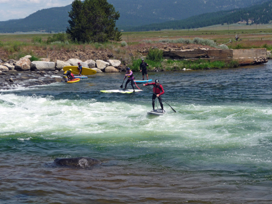 Stand up board surfing Kellys whitewater park ID