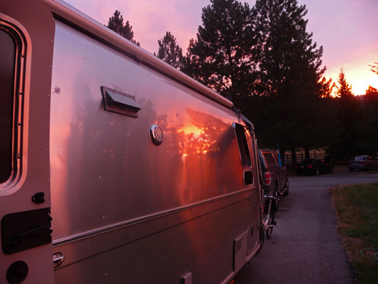 Sunset refected in side of Genevieve Airstream