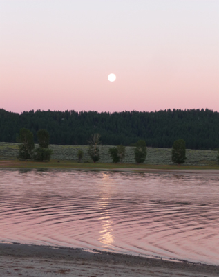 Full moon reflected in Lake Cascade