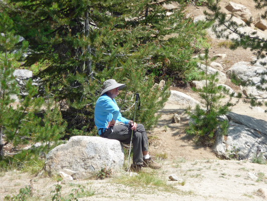 walter cooke sitting on a rock