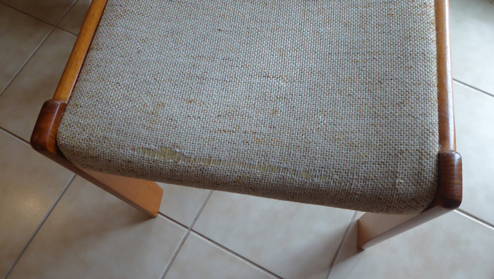 Worn out fabric on chair