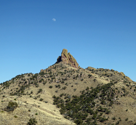 Half moon over rocky tor