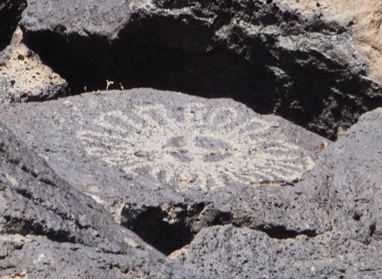 Sunburst petroglyph Piedras Marcasas Trail