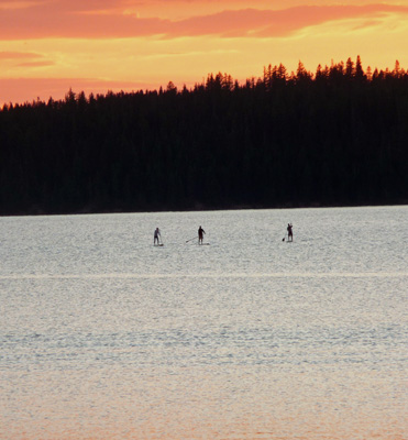 Paddle Boarders at sunset Paulina Lake OR