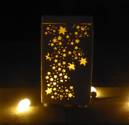 Lit ceramic luminaria