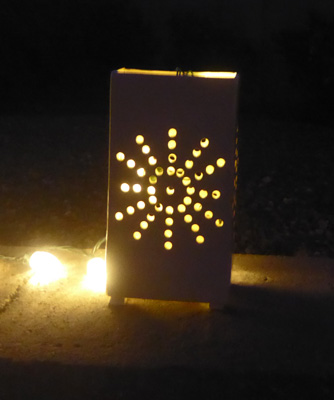 Lit ceramic luminaria