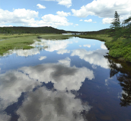 Clouds reflected in Sandy Pond