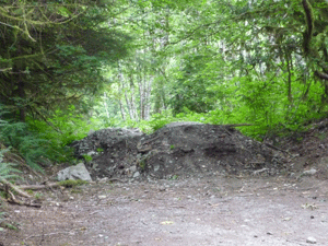 Dirt piled over road at the beginning of trail to Trout Creek northeast of Index, WA